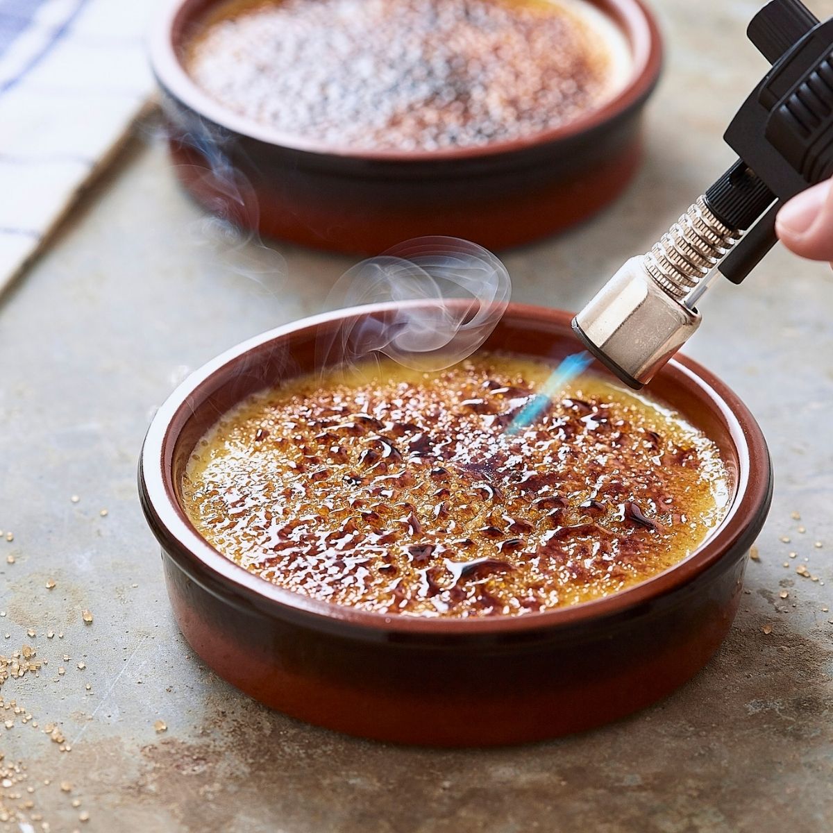 using a kitchen torch to make creme brulee