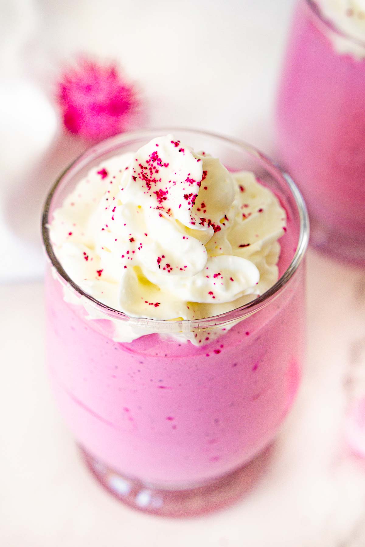 pink healthy valentine's day dessert of whipped cottage cheese with dragon fruit powder