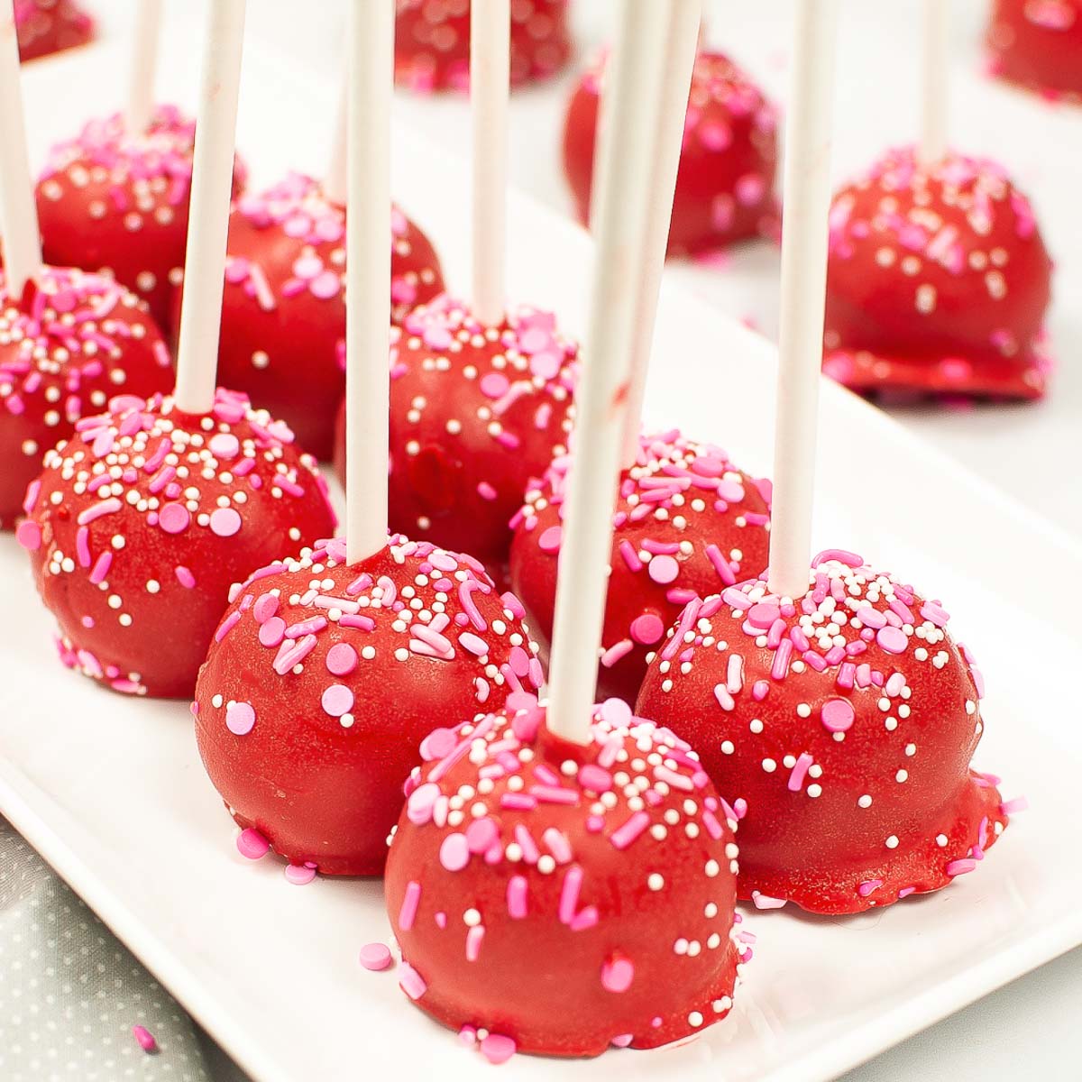 plate of red valentine's day cake pops