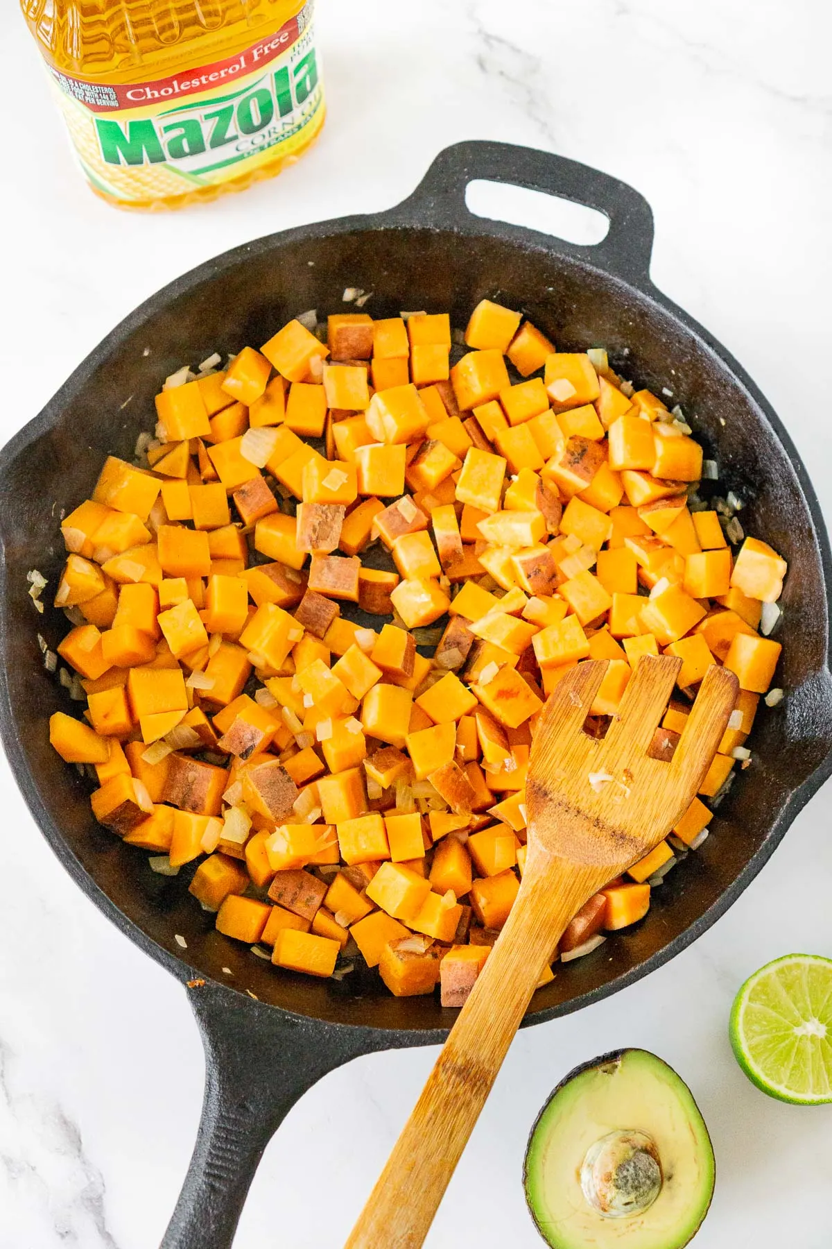 cubed sweet potato cooked in a skillet