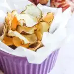 Baked jerusalem artichoke chips in a bowl.