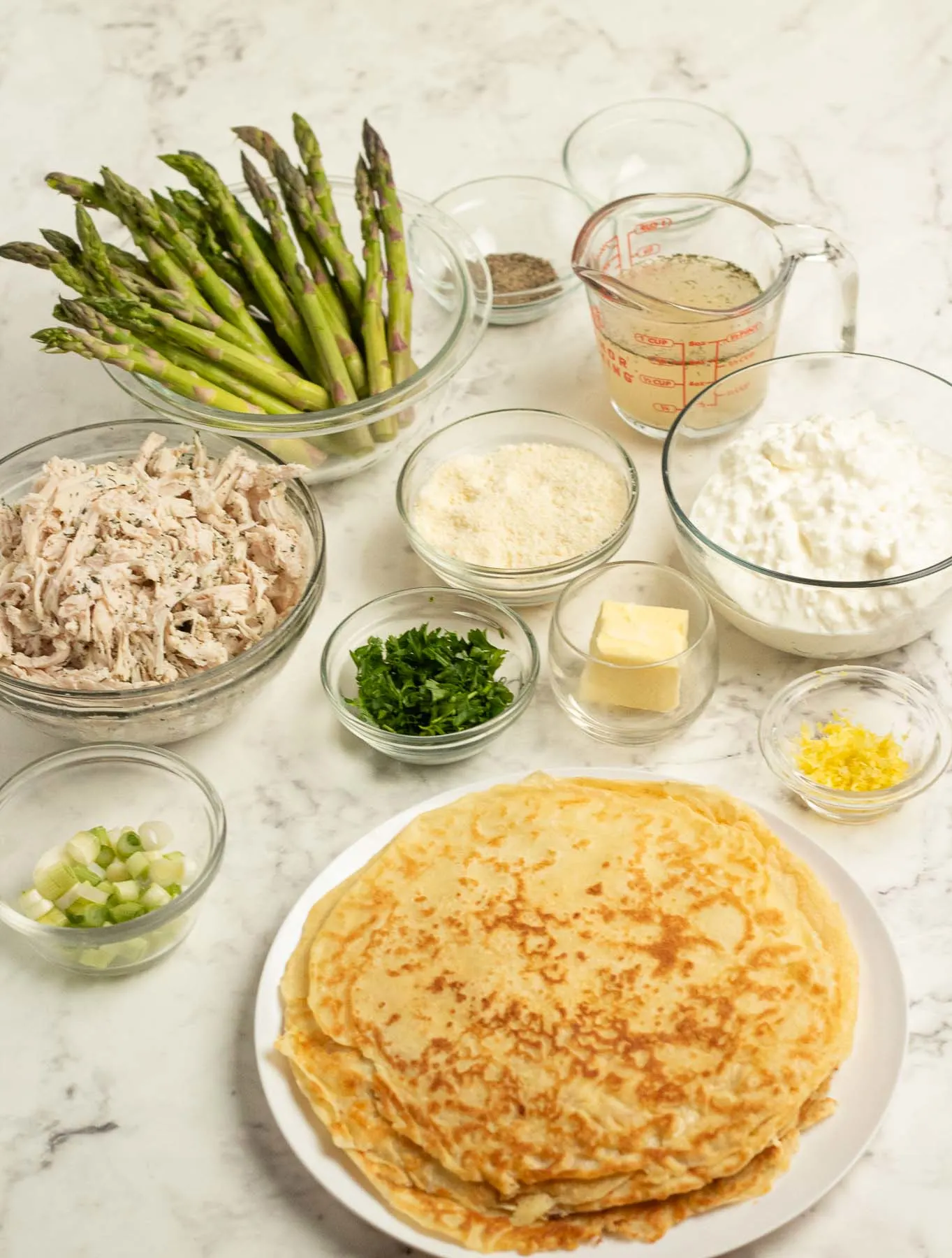 Ingredients for savory chicken crepes with asparagus.