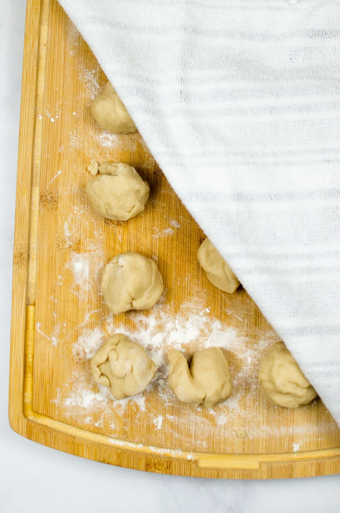 Flour tortilla dough rolled into small balls.