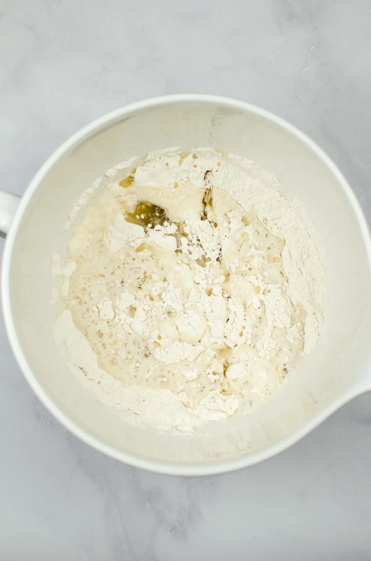 Rough tortilla dough in a bowl.