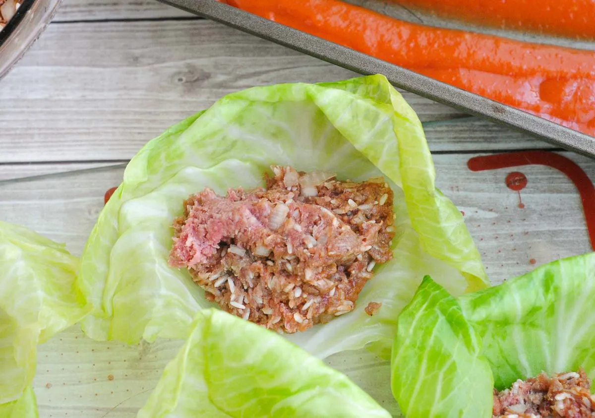 Ground beef and rice mixture in a cabbage leaf.