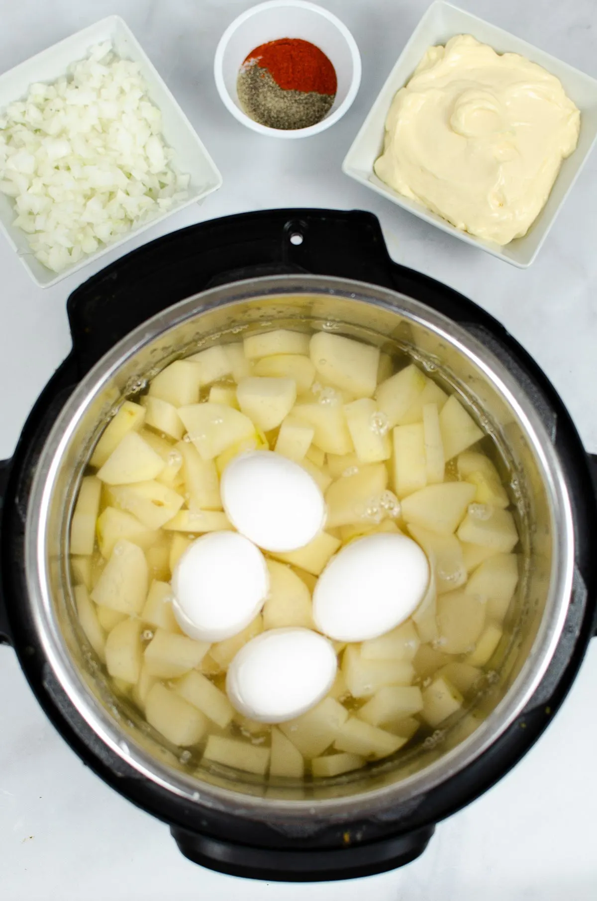 Chopped potatoes and eggs in the Instant Pot.