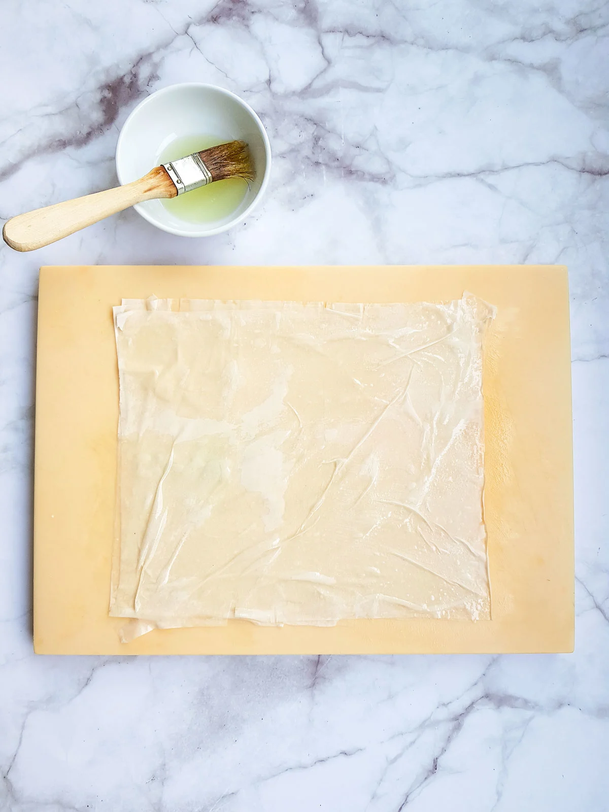 Phyllo dough sheets brushed with oil.