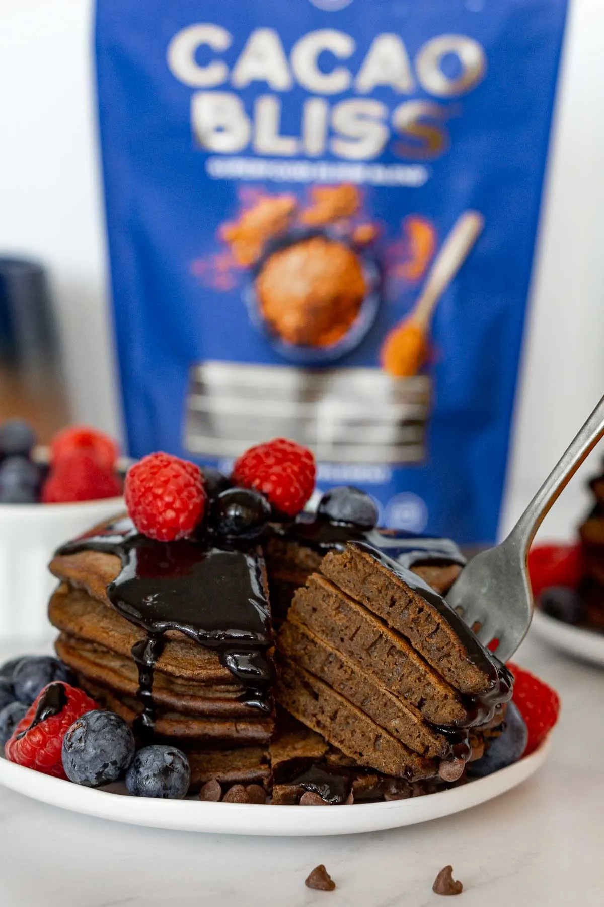 Stack of chocolate pancakes cut open.