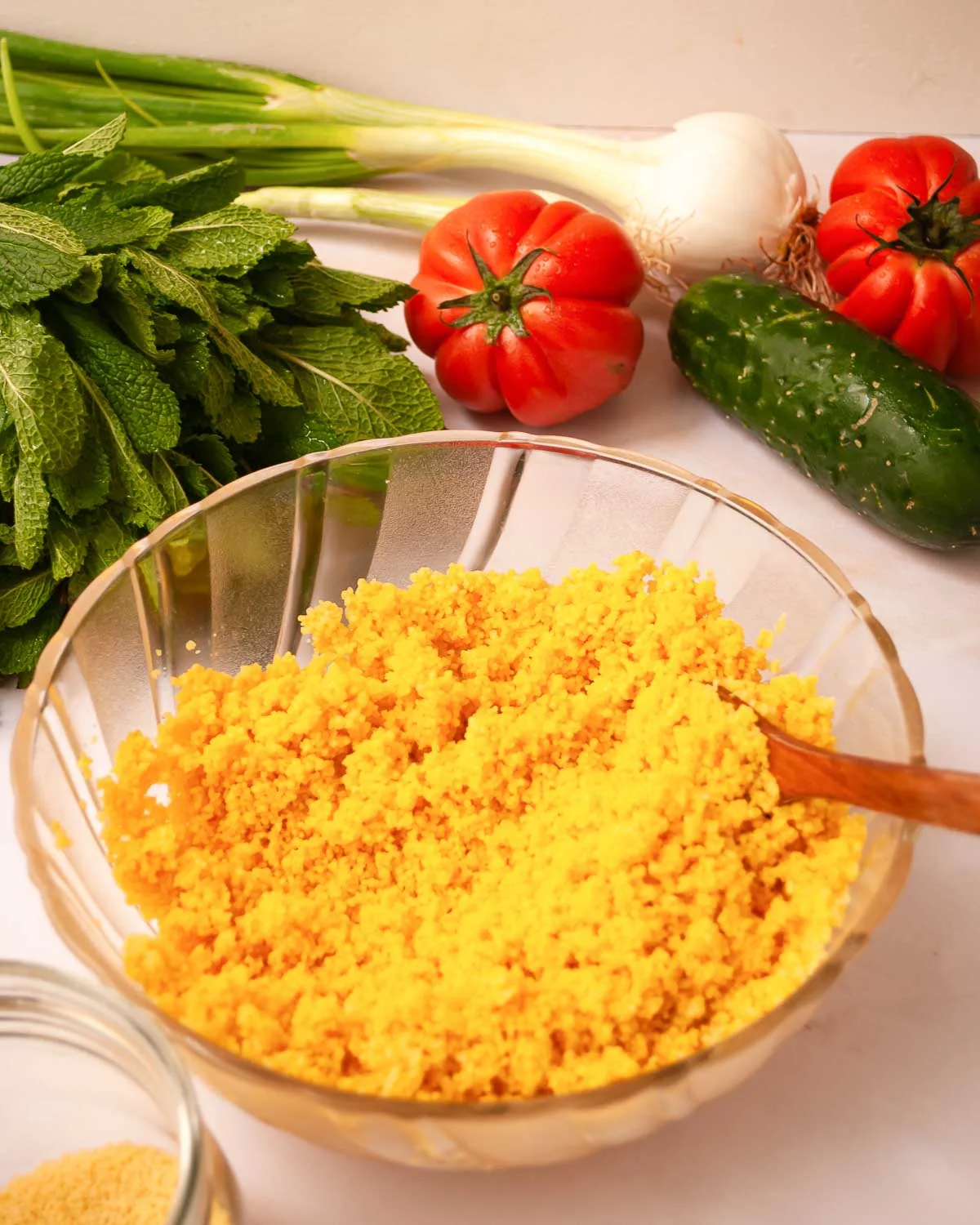 Bowl of golden couscous with turmeric.