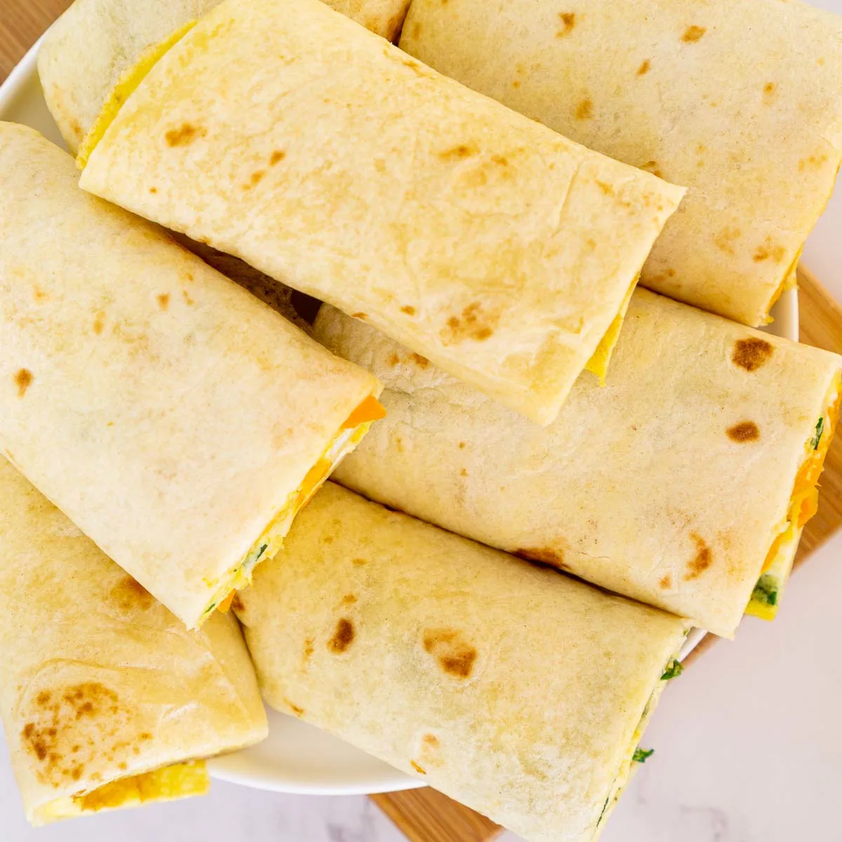Tortilla egg wraps on a plate.