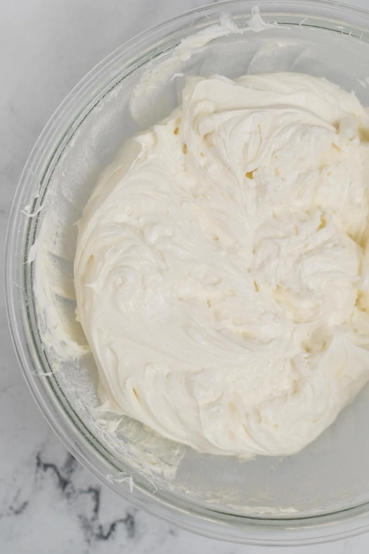 Cream cheese icing in a bowl.