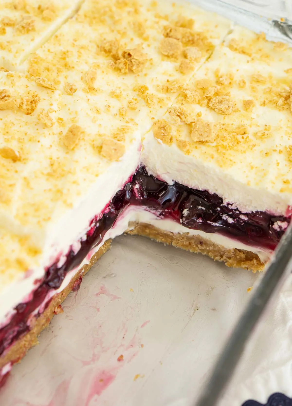 Baking pan with layered no-bake blueberry delight dessert.