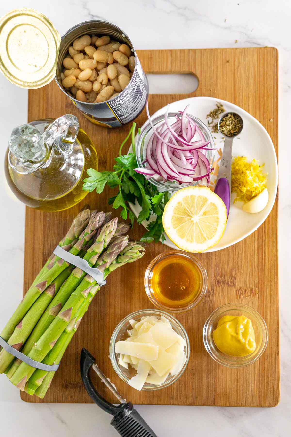 Ingredients to make asparagus and white bean salad.