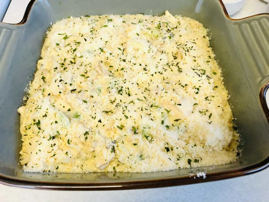Chicken and wild rice casserole in a baking pan before baking.