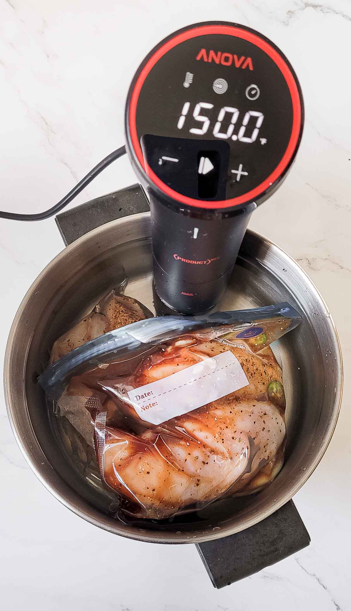 Making sous vide pulled chicken.