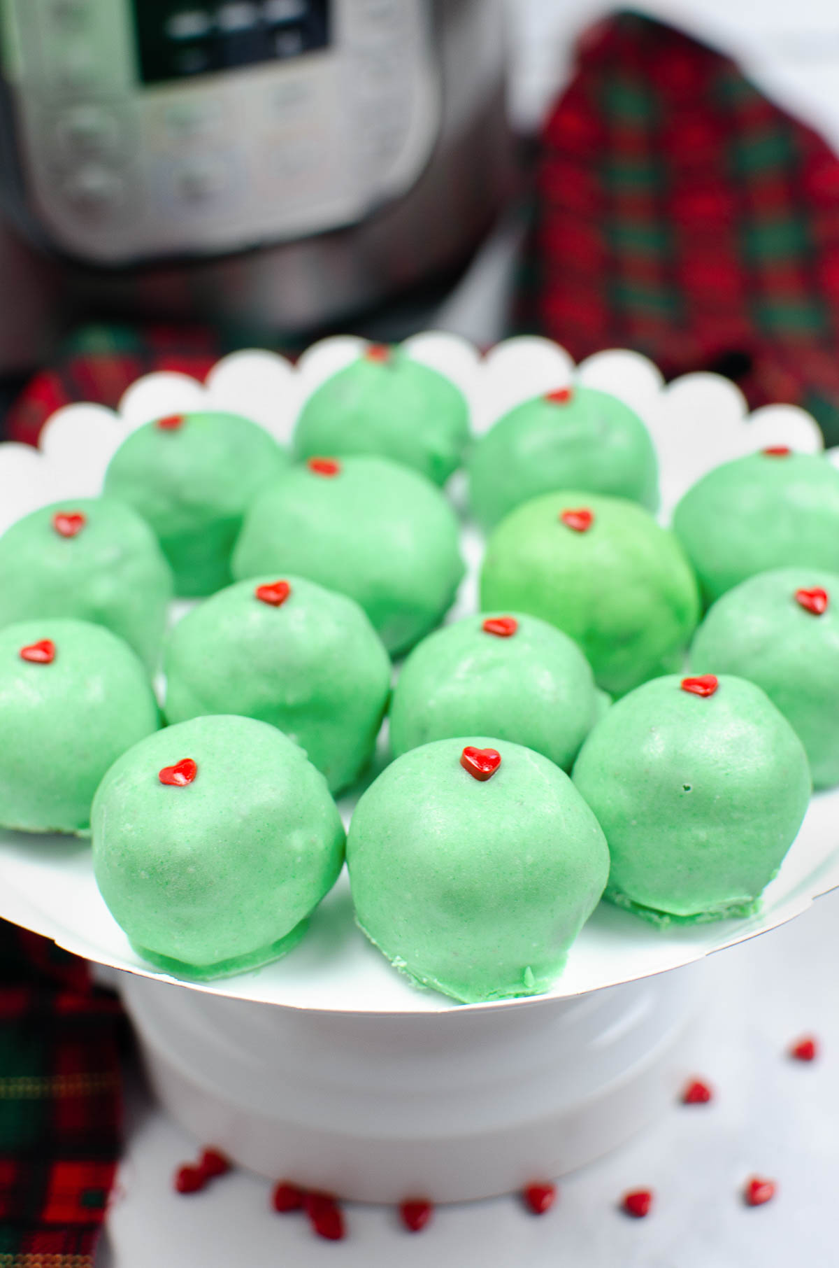 Grinch Cake Balls on a plate.