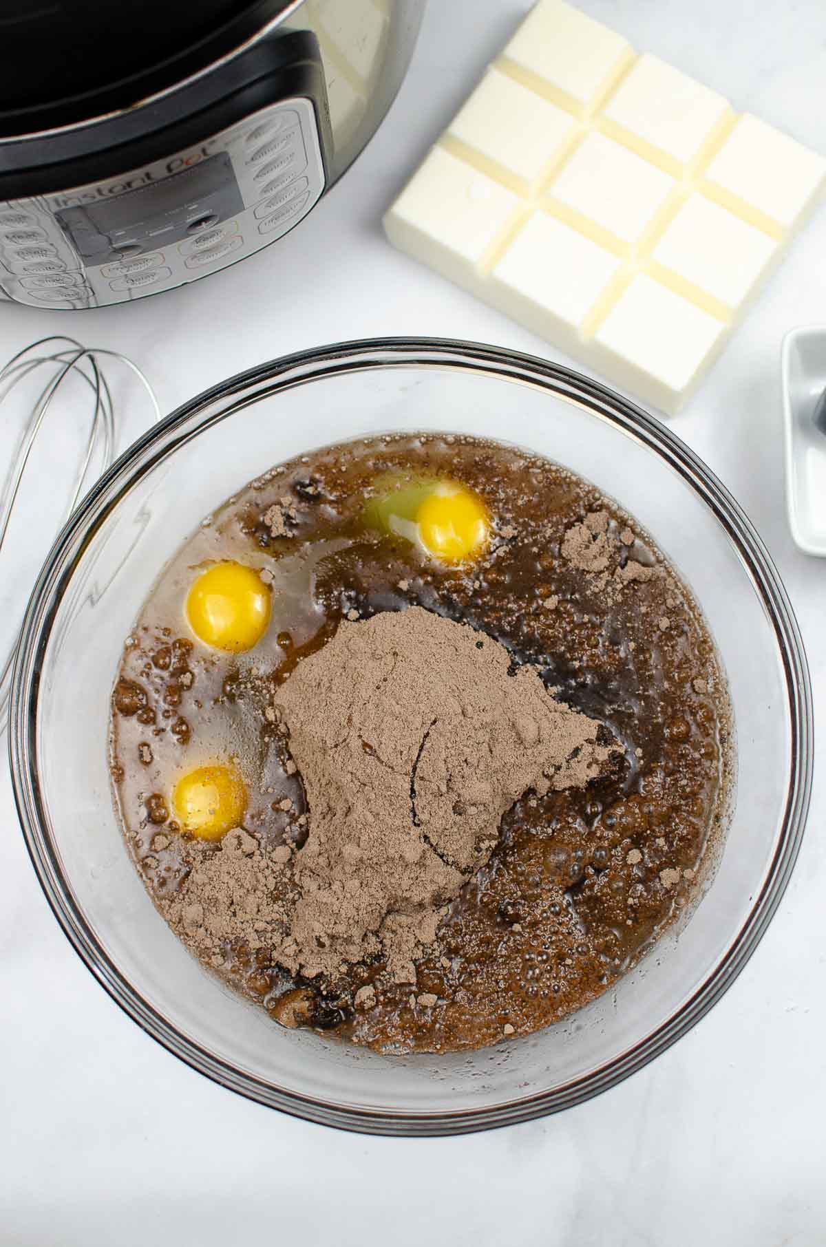 Ingredients to make Devil's food cake from a box in a bowl: cake mix, 3 eggs, oil.