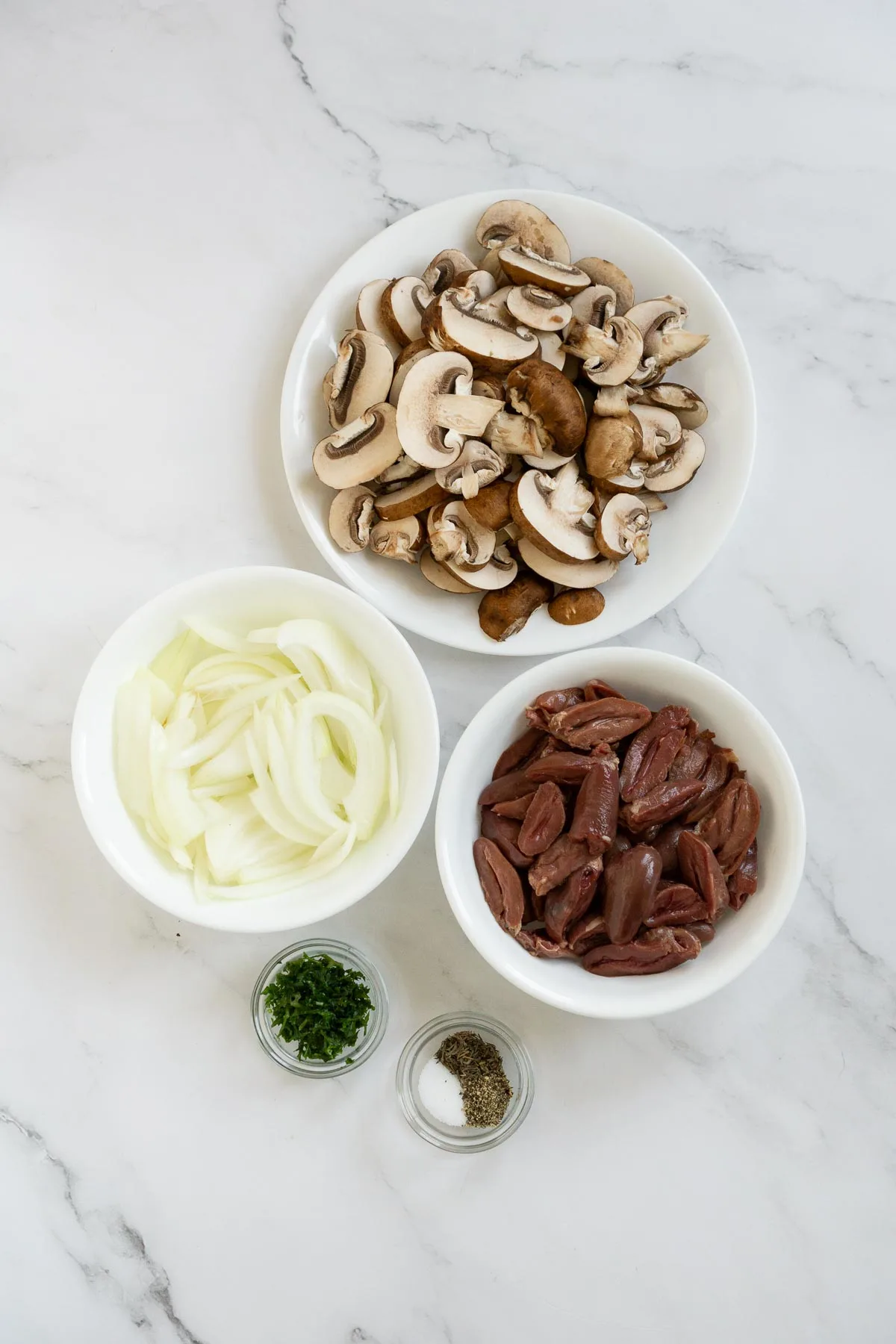 Ingredients to make chicken hearts with mushrooms.