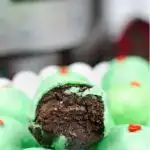 Pinnable image of Grinch chocolate cake balls.