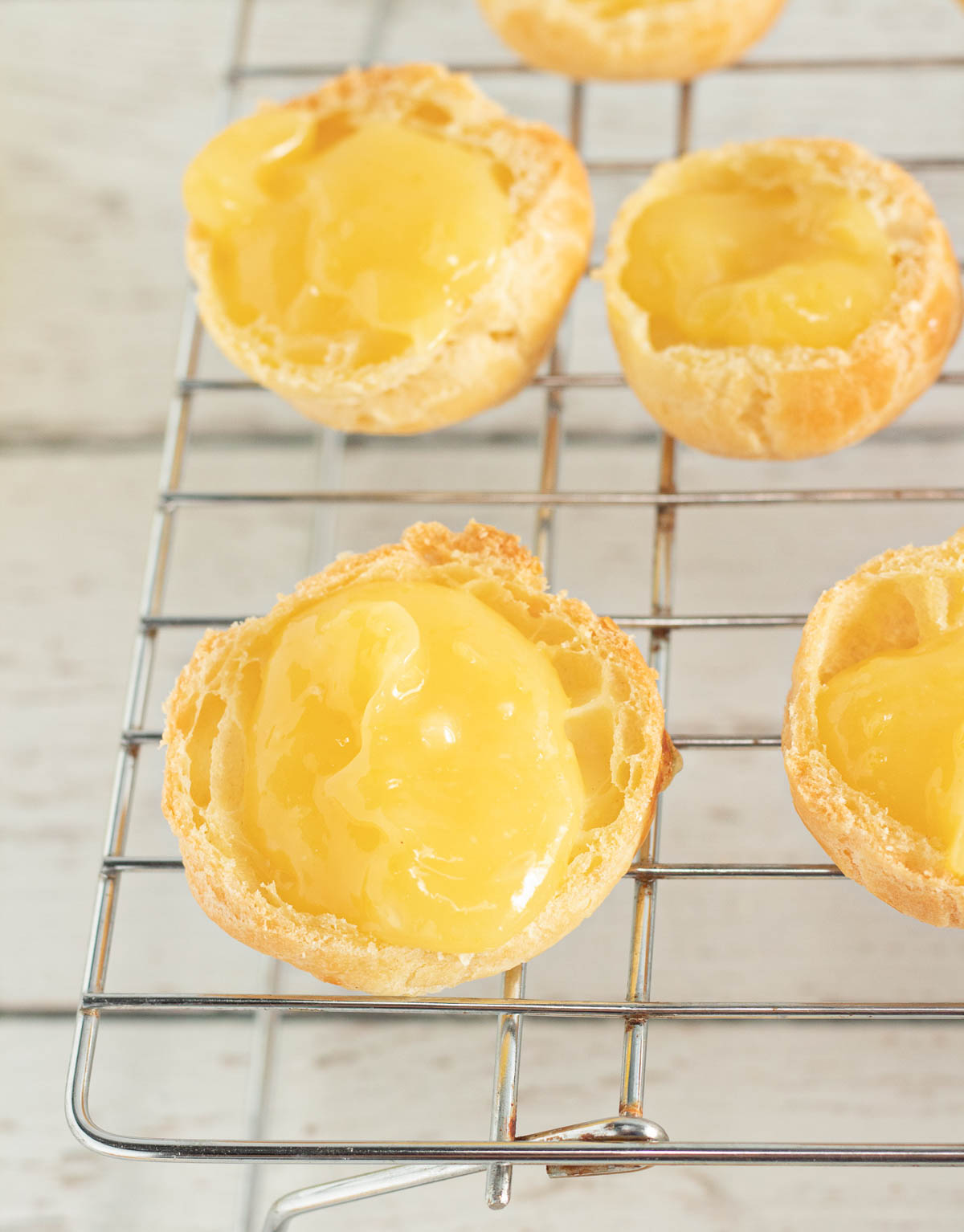 Cream puffs cut in half and filled with lemon curd.