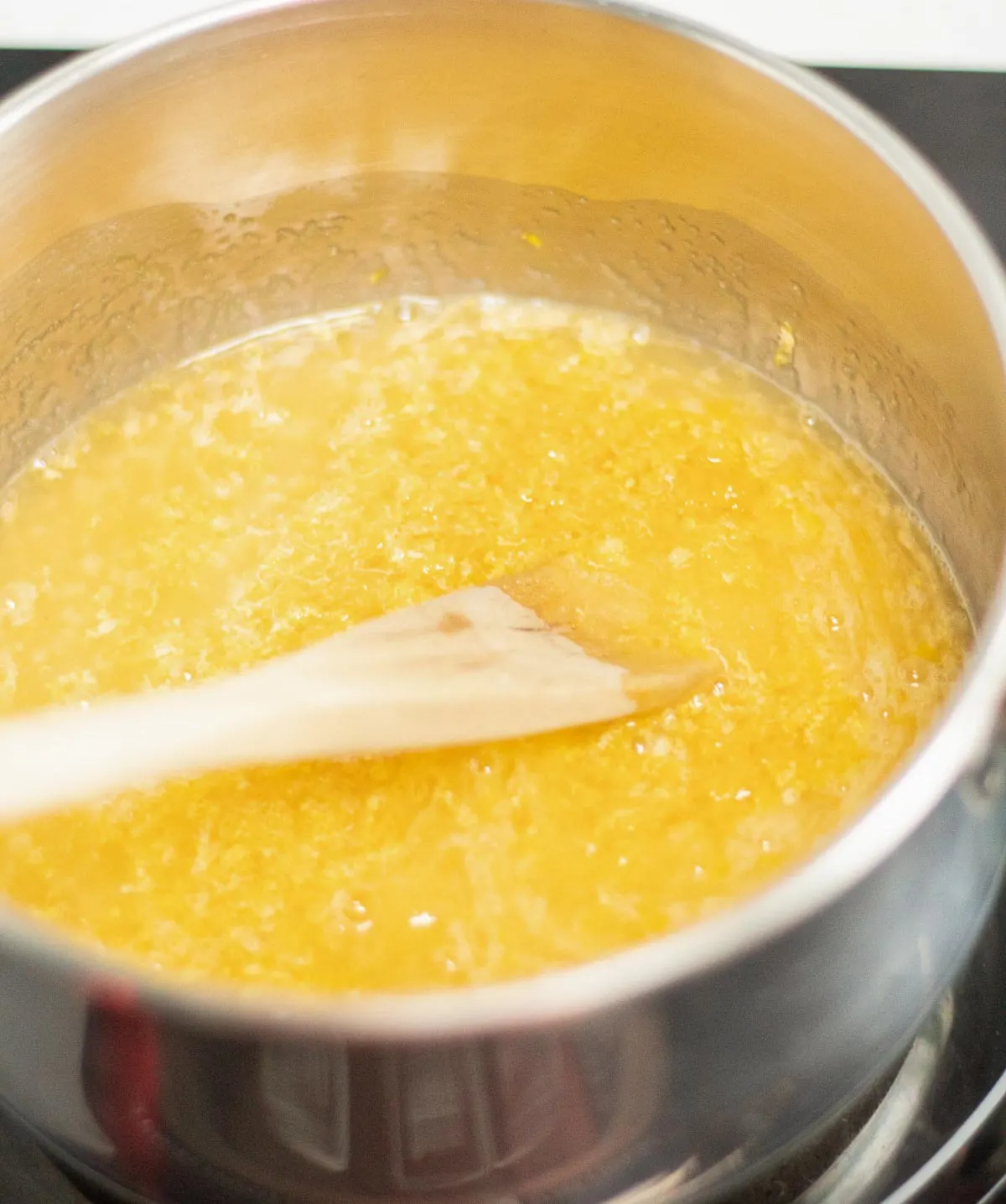 Making lemon curd in a saucepan.