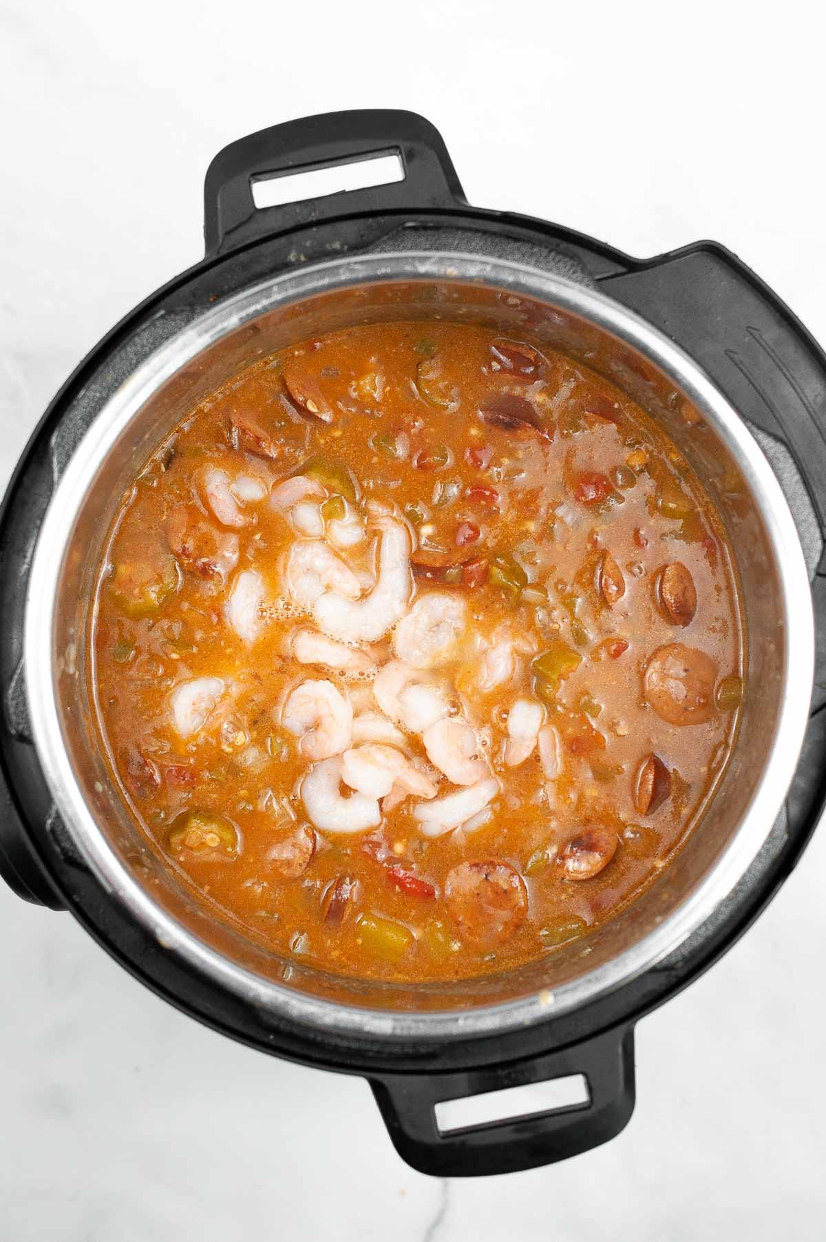 Adding shrimp to gumbo in the Instant Pot