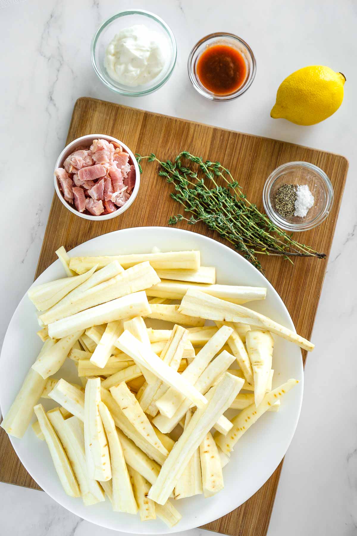Ingredients to make roasted parsnip fries with bacon