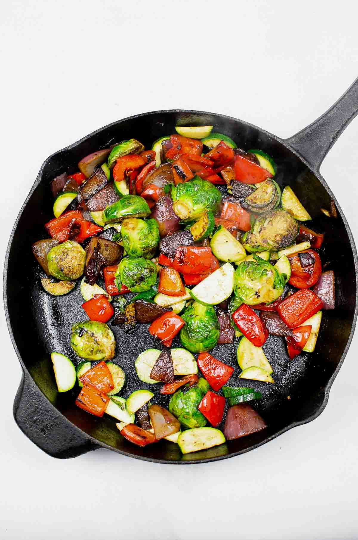 Vegetable stir fried in a cast iron skillet
