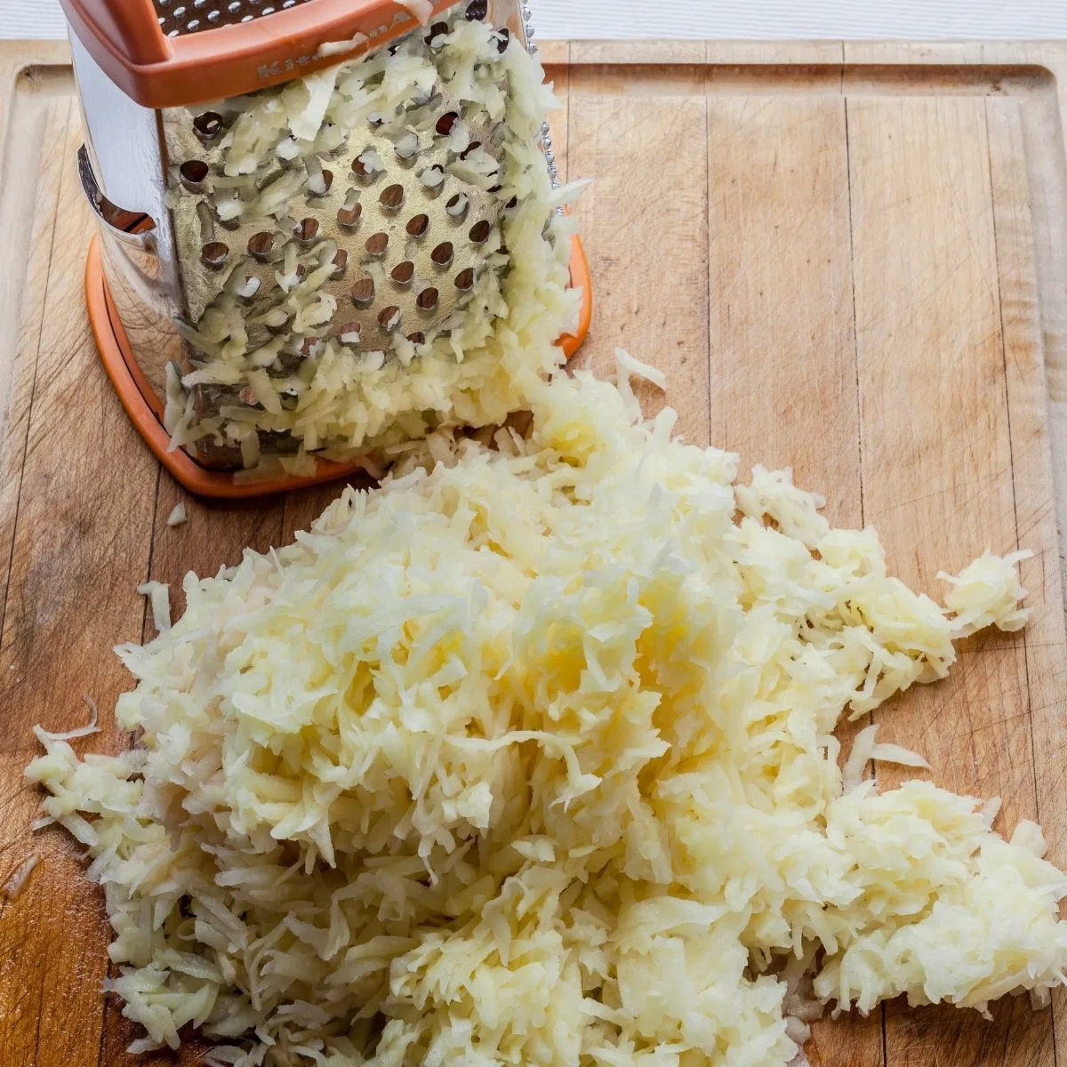 Grated potato on a cutting board