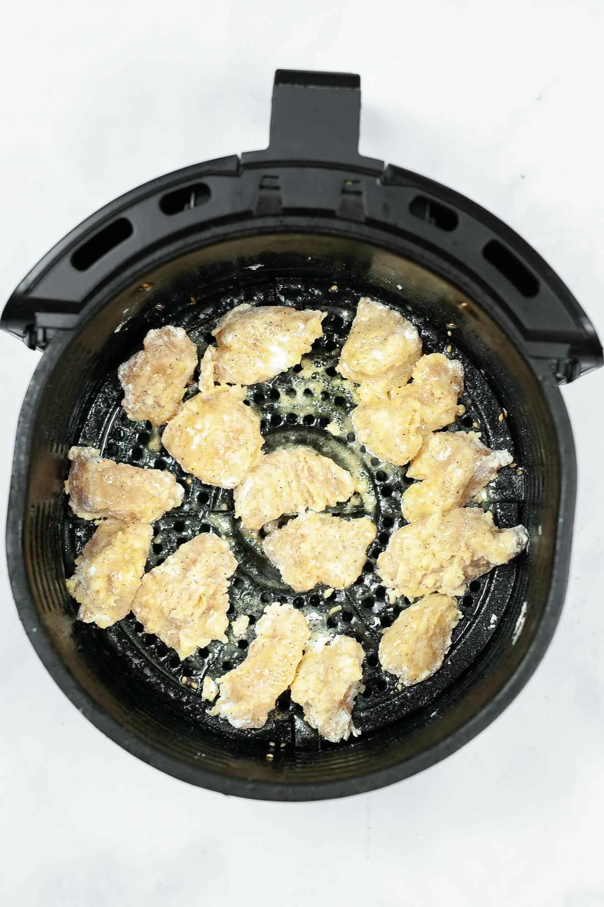 Chicken pieces in an air fryer