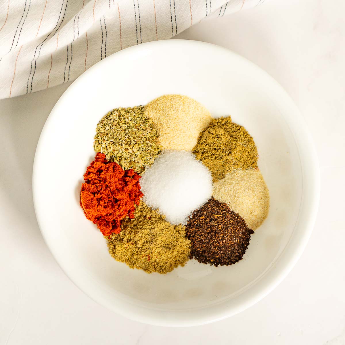 Ingredients for taco seasoning on a plate