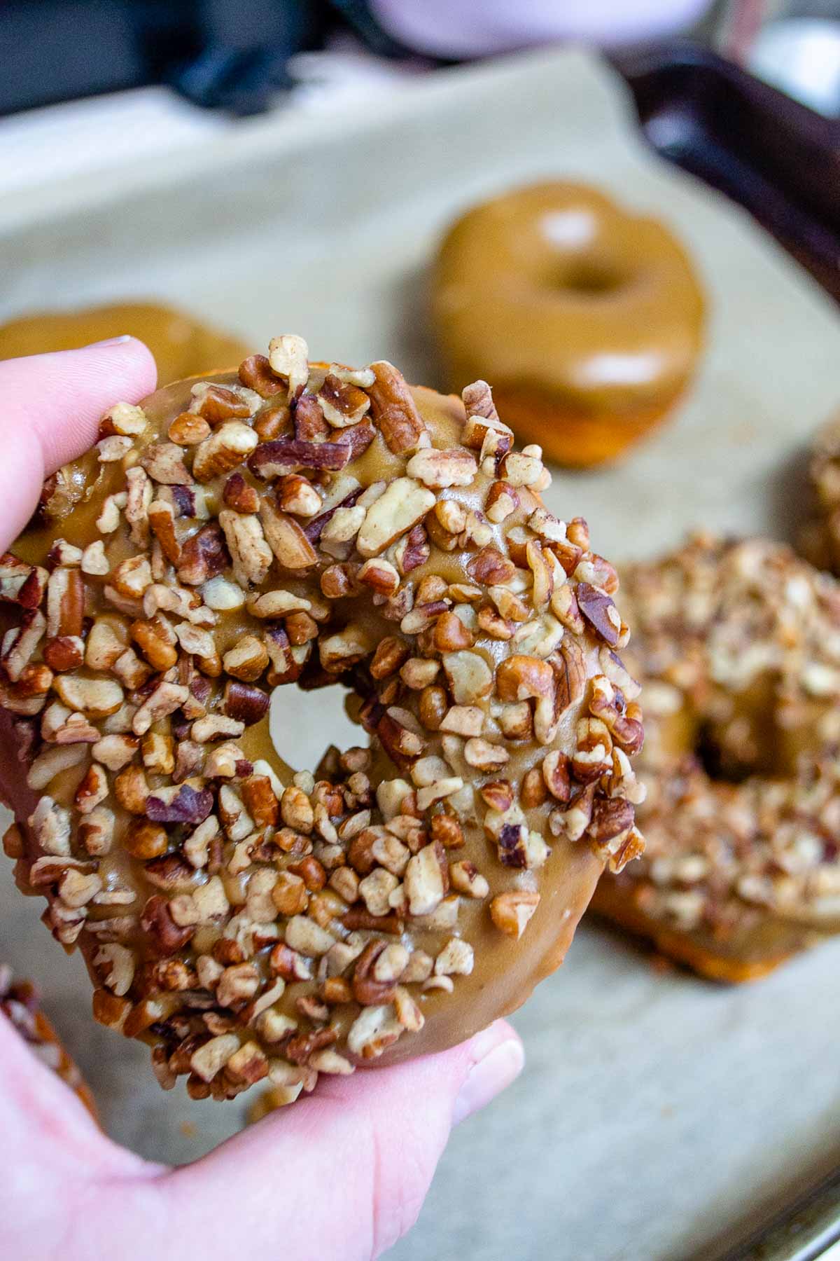 Caramel donut with crushed pecans