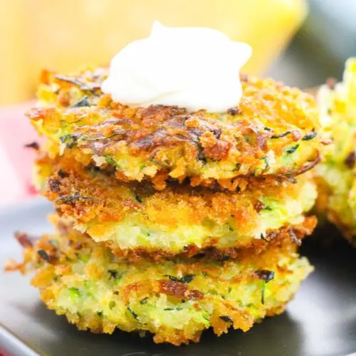 Zucchini fritters topped with sour cream