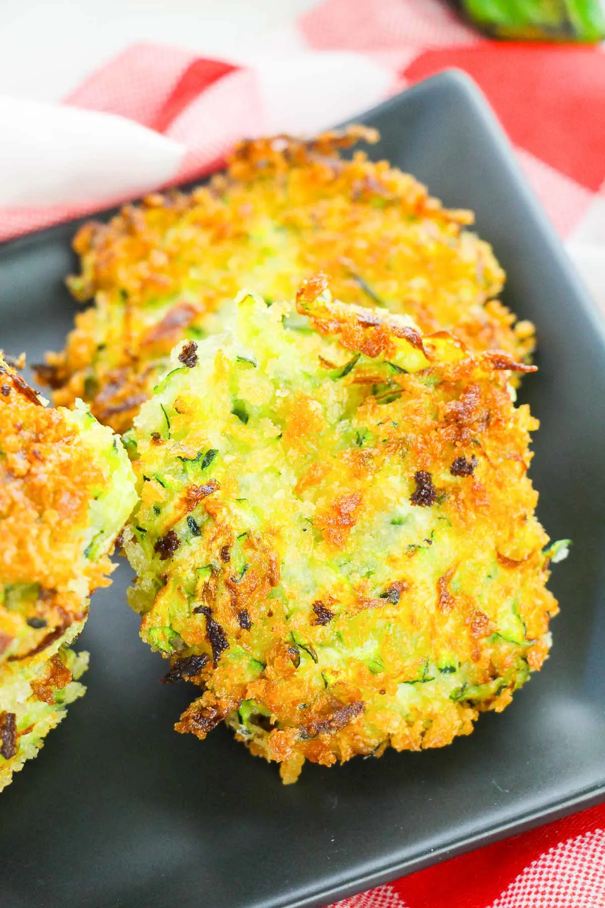 Close up of zucchini fritter to show crispy texture