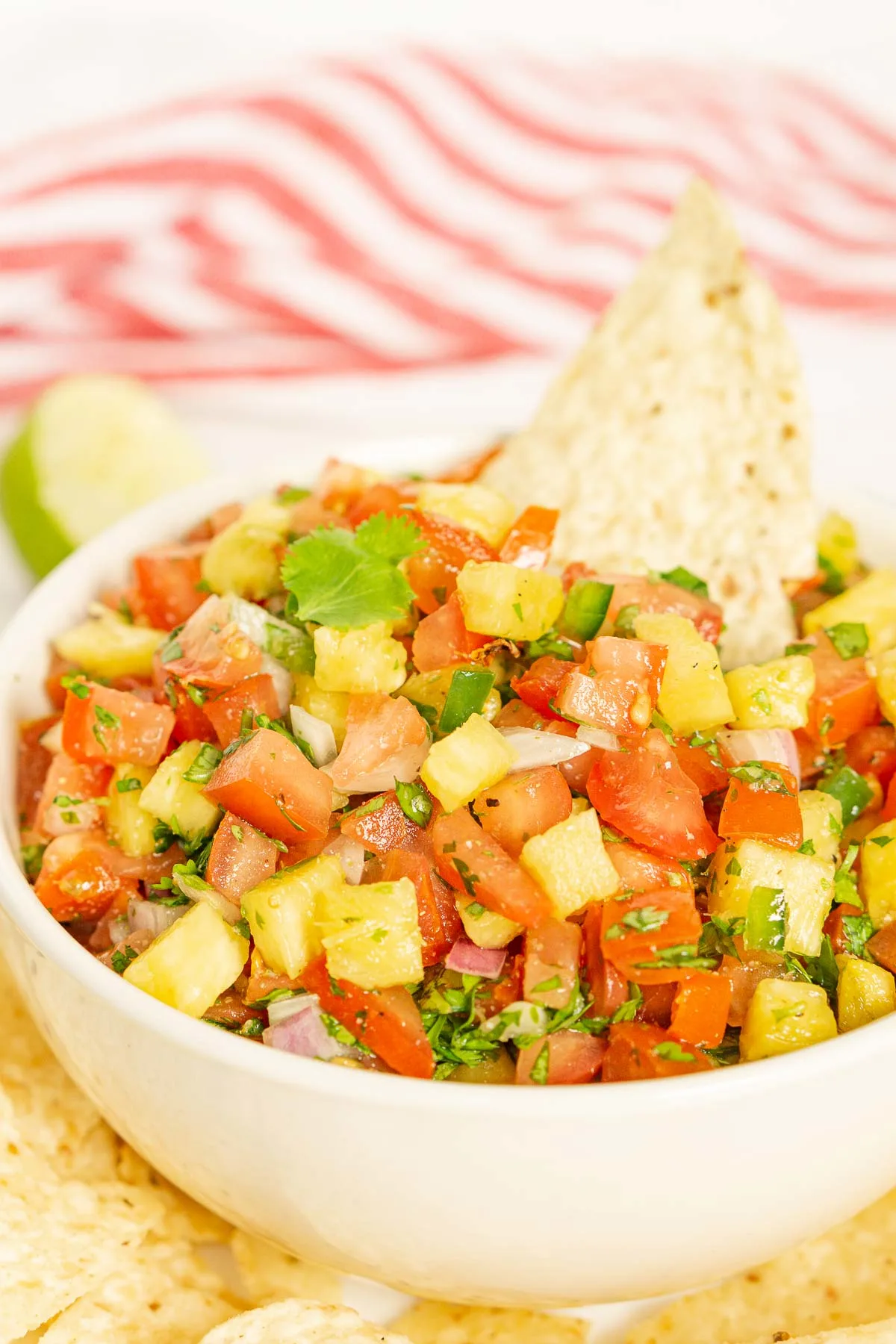 Pico de gallo with pineapple and a tortilla chip
