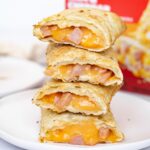 Stack of air fried hot pockets cut in half to show texture inside.