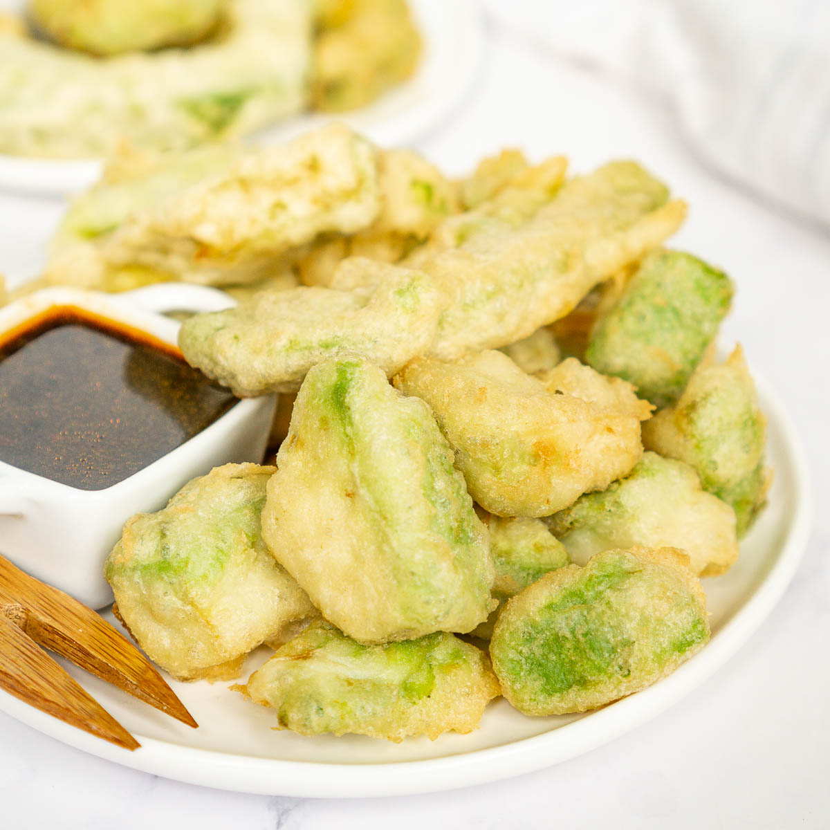 Avocado tempura pieces on a plate