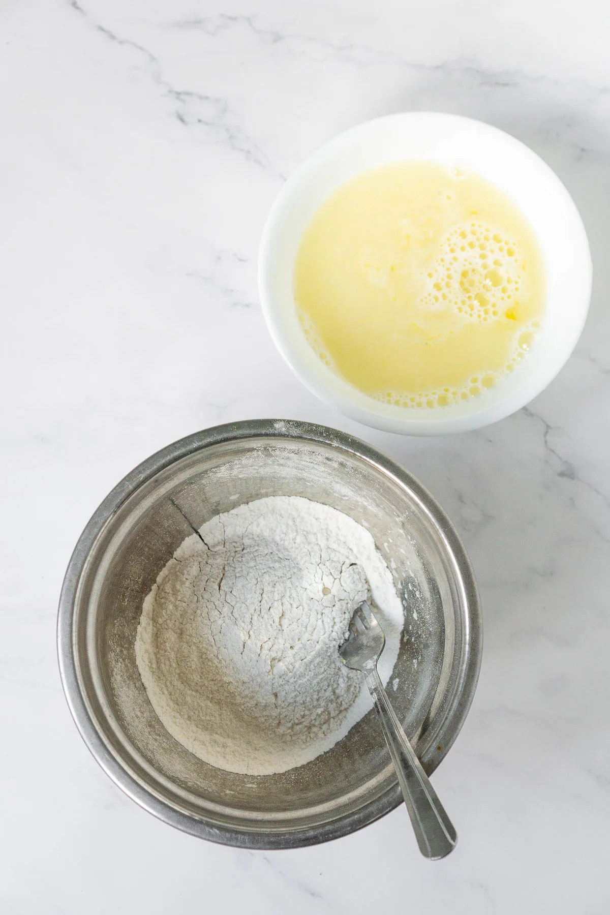 2 bowls, one with sifted flour, the other with egg and cold water mixture