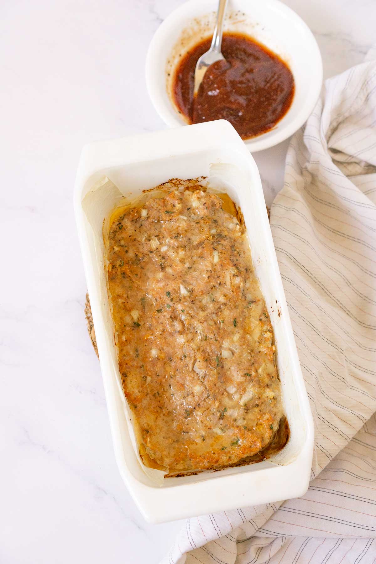 Cooked meatloaf in a loaf pan