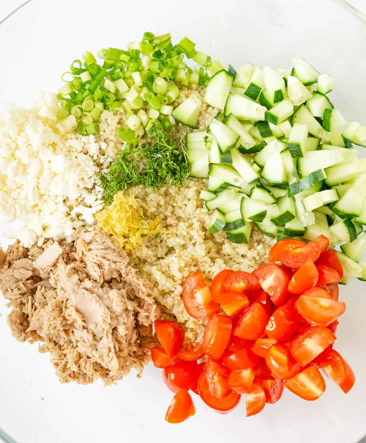 All the ingredients for tuna quinoa salad in a bowl.