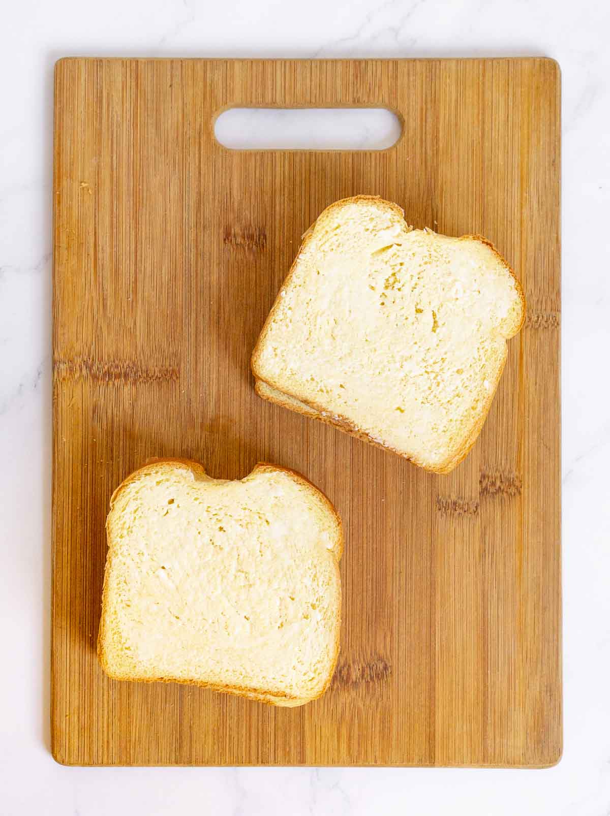 Butter spread on sliced bread