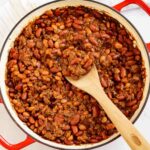 Skillet of baked beans with ground beef.