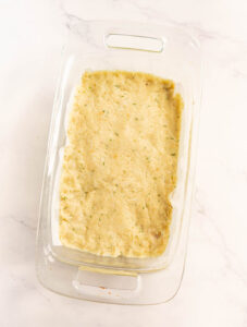 Fish loaf mixture pressed into a loaf pan