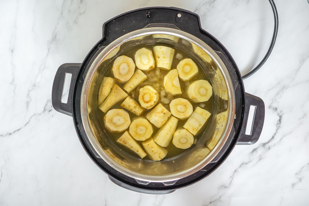 Parsnips and broth added to the Instant Pot