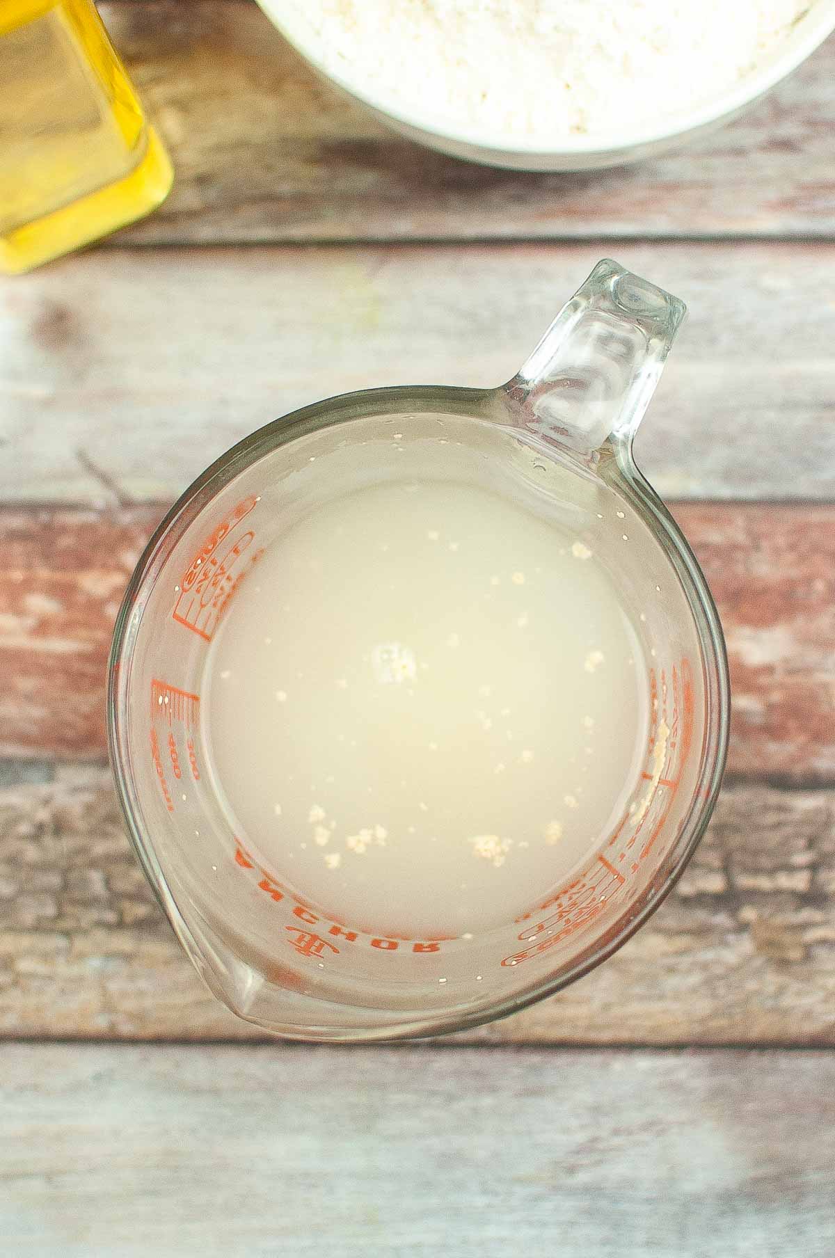 Yeast, sugar, and warm water in a container