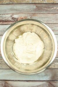 Focaccia dough in an oiled bowl