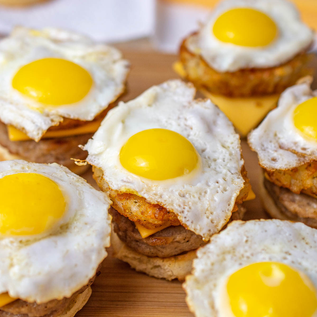 Fried quail eggs on mini breakfast sandwiches
