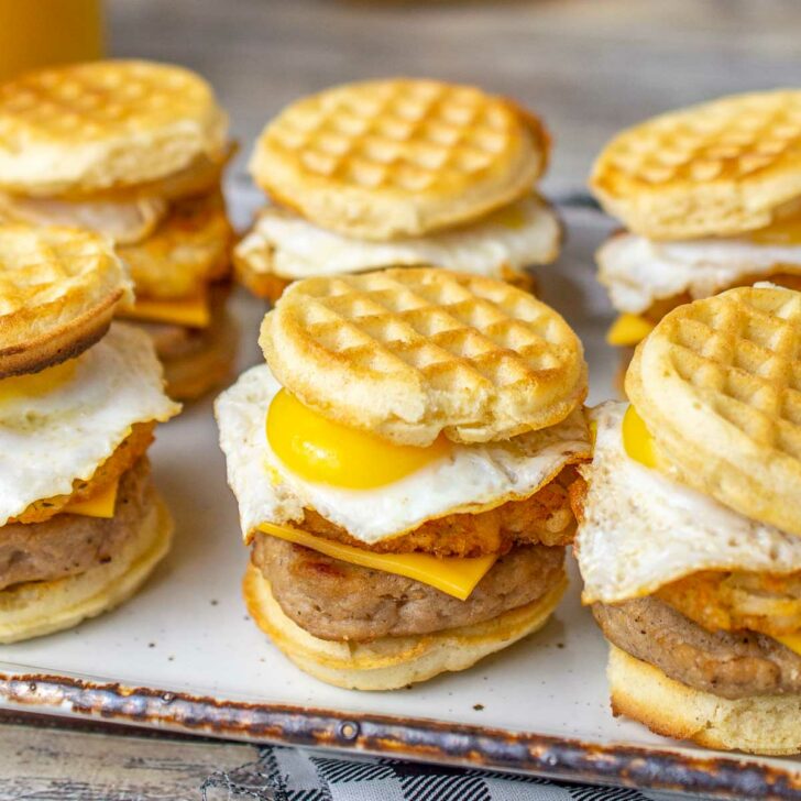 Plate of mini breakfast sandwiches with mini waffles with fried quail eggs