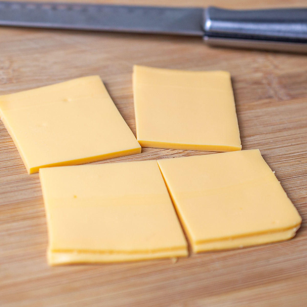 Slices of cheese cut into 4 squares
