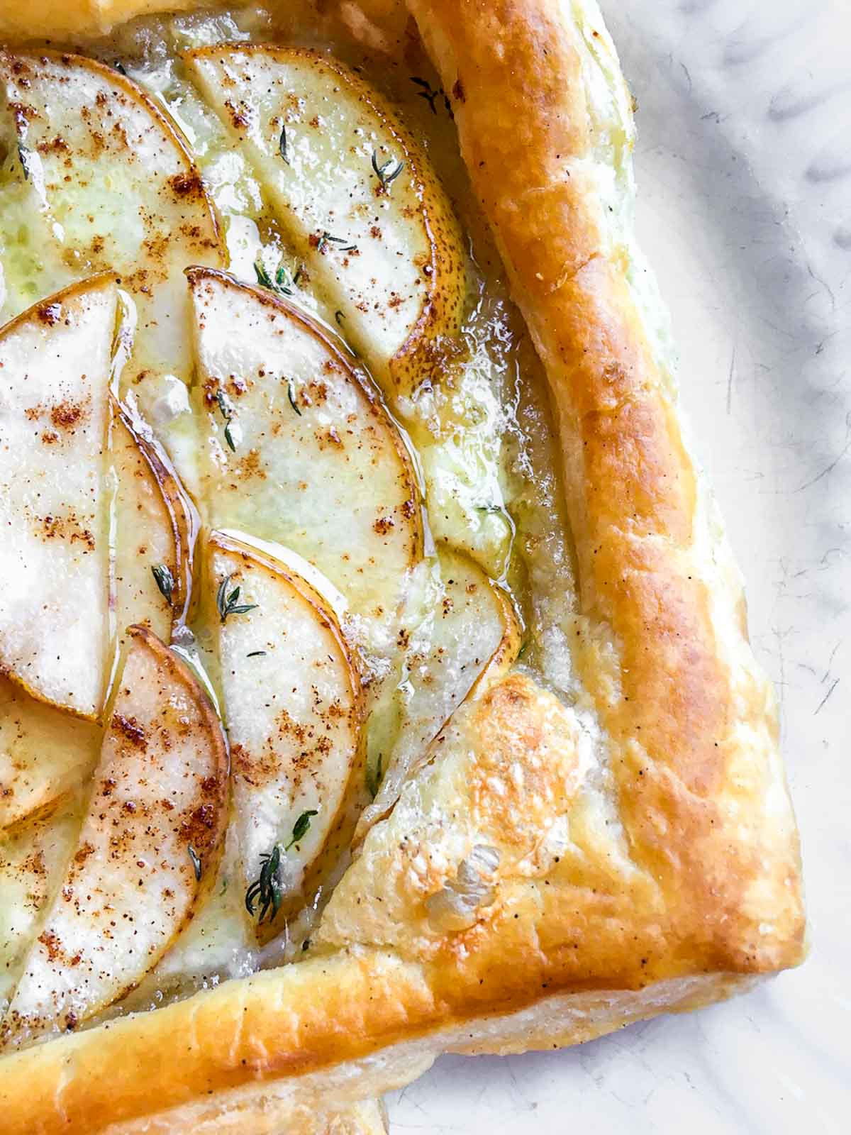 Flaky puff pastry topped with brie and pear slices